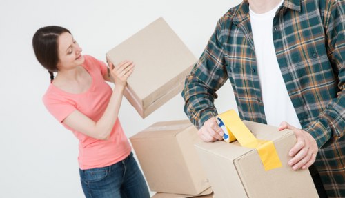 Local moving team handling furniture near West Kensington flats