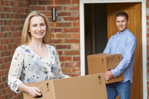 Loading furniture into a moving truck in West Kensington