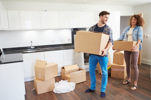 Loading furniture into a removals van for a local move