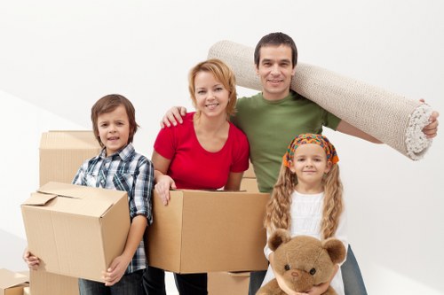 Professional movers handling furniture and boxes in West Kensington