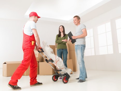 Packed boxes and furniture ready for a local West Kensington removal