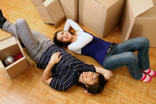 Furniture pick-up process in a West Kensington apartment building with stair access